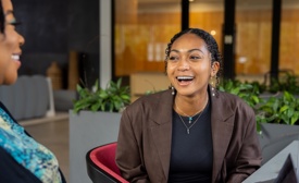 a person sitting in a chair laughing