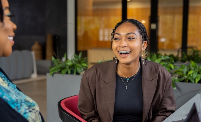 a person sitting in a chair laughing