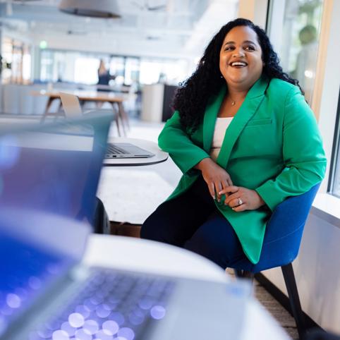 Cox employee sitting at a table
