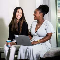 Two employees smiling