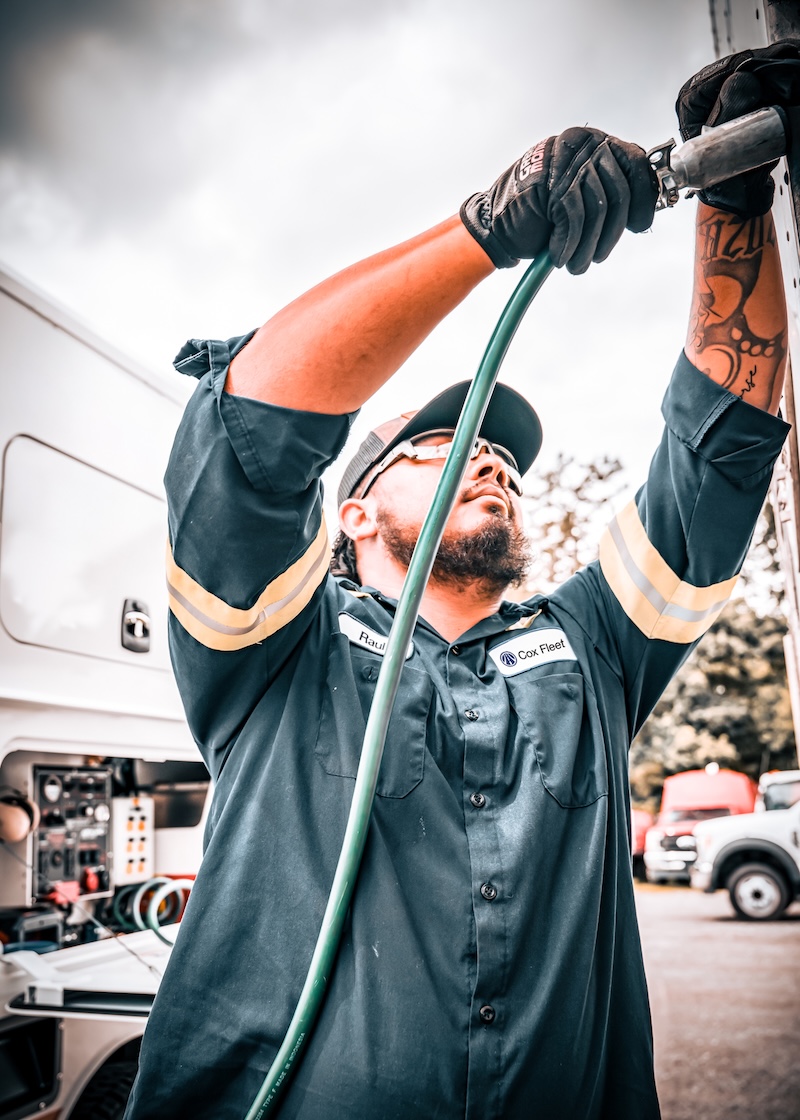 a person holding a hose