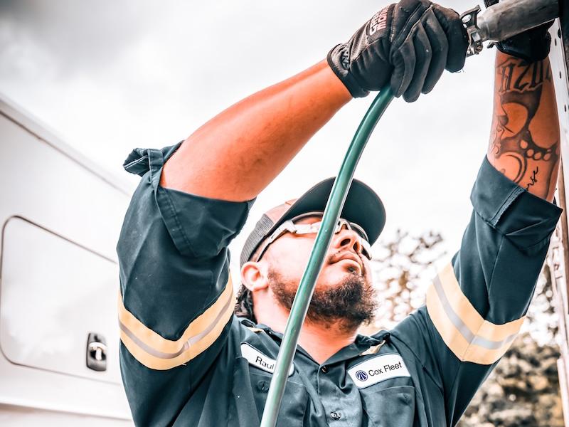 a person holding a hose