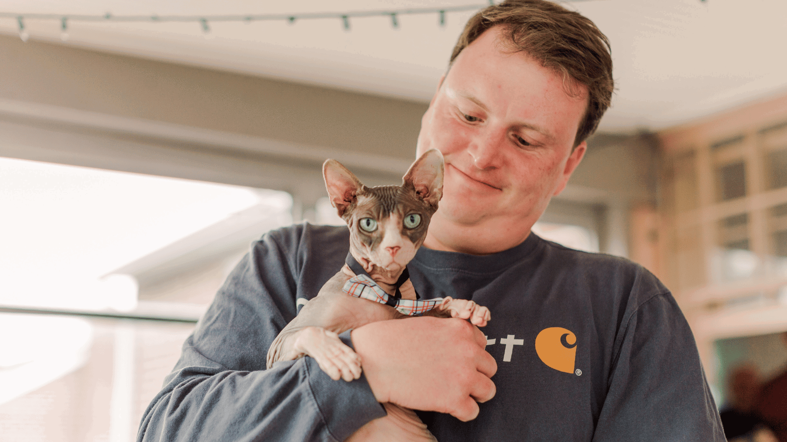 Chris Carey Cox employee with his cat