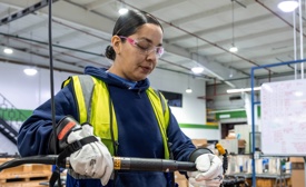 Cox Employee working on EV battery