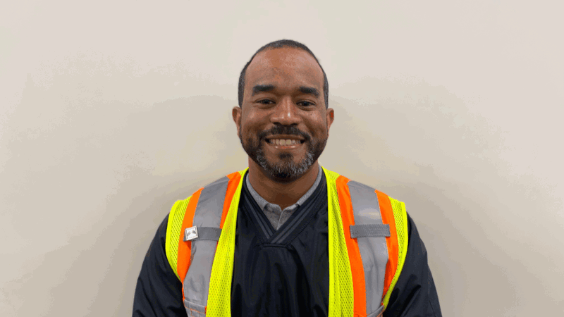 Cox employee smiling at camera