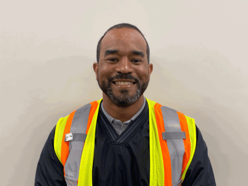Cox employee smiling at camera