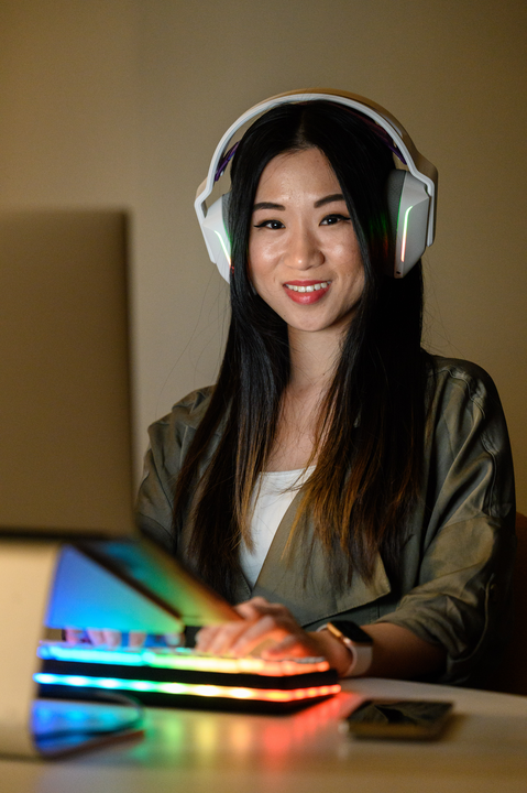 A cox employee wearing headphones and smiling