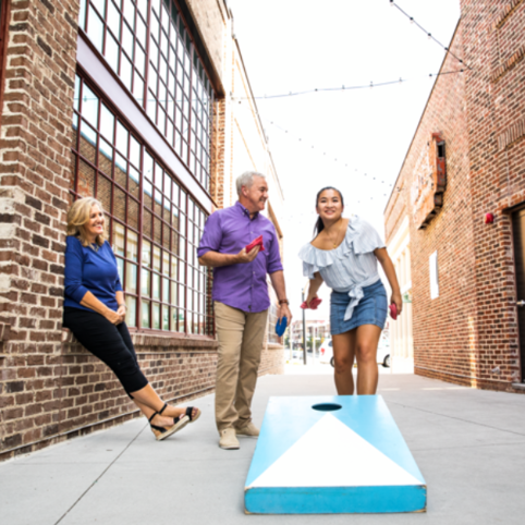 Cox employees playing cornhole