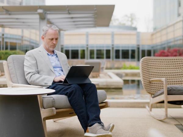 Cox employee sitting outside the Cox headquarters