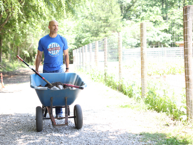 Cox employee volunteering outdoors