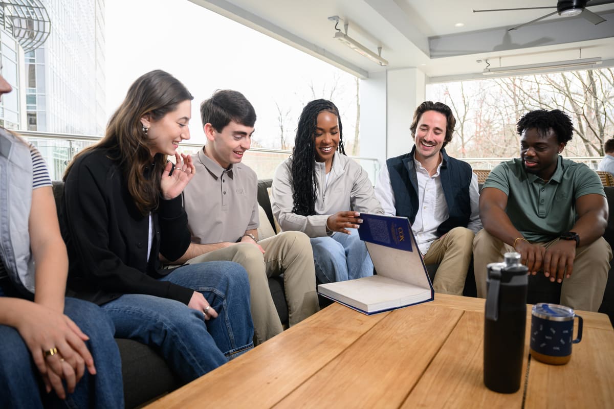 a group of people sitting around a table