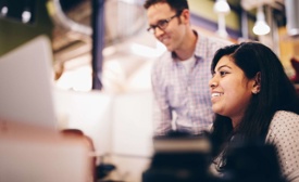 Autotrader employees working at computer
