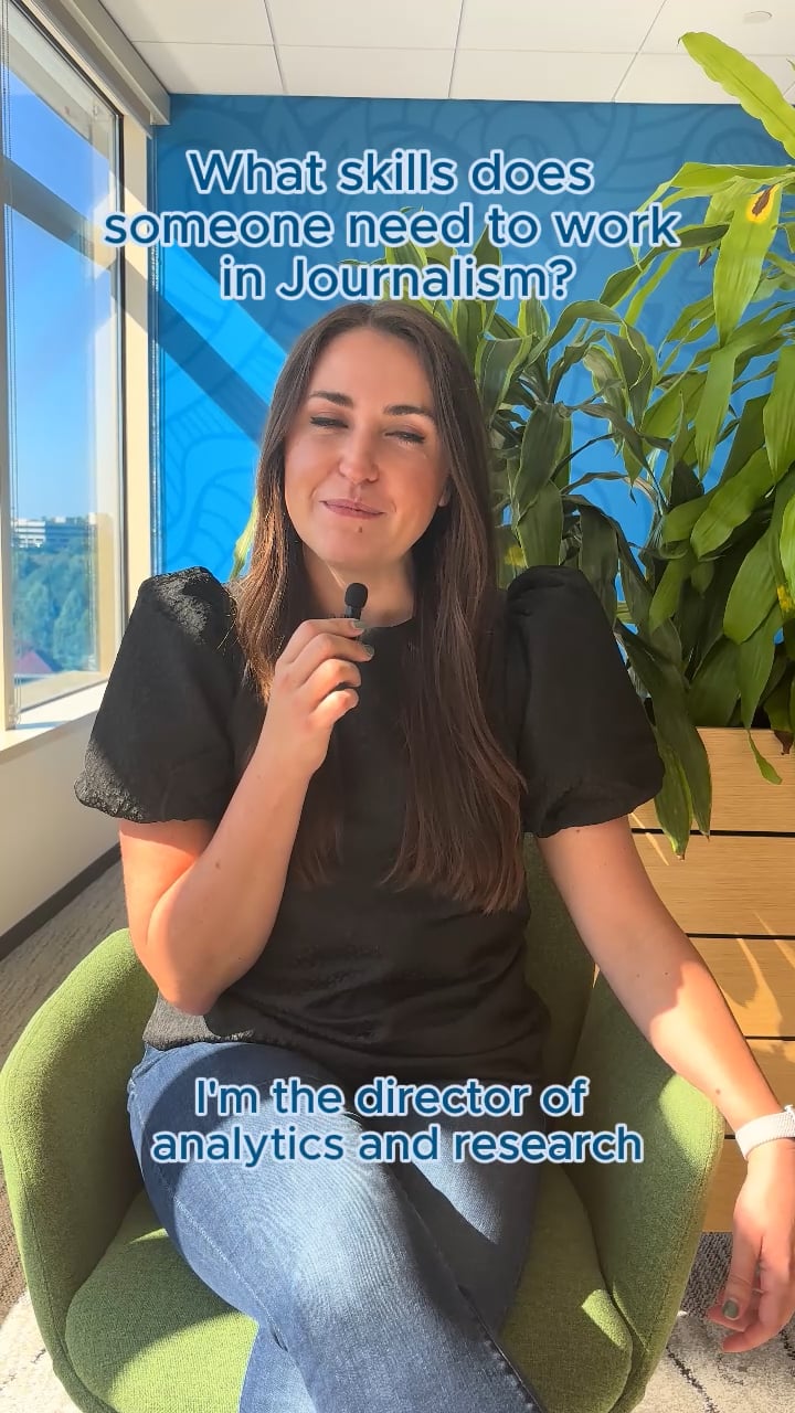 a person sitting in a chair with a microphone
