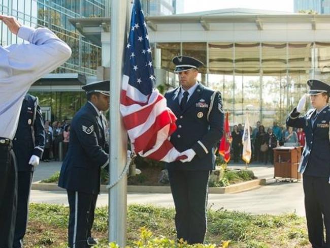 Veterans raising the flag at Cox