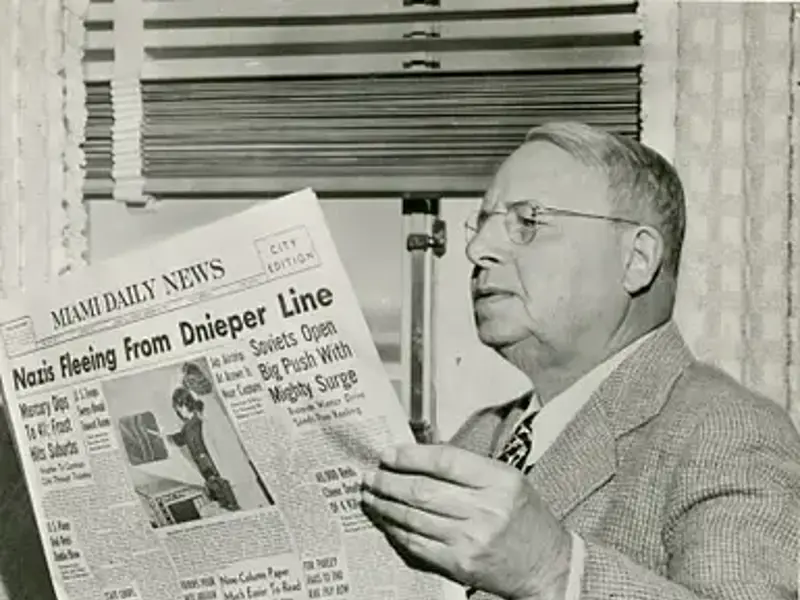 Governor cox with a Newspaper