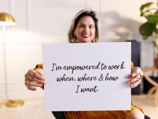 Cox employee holding sign that says "I'm empowered to work when, where, & how I want"