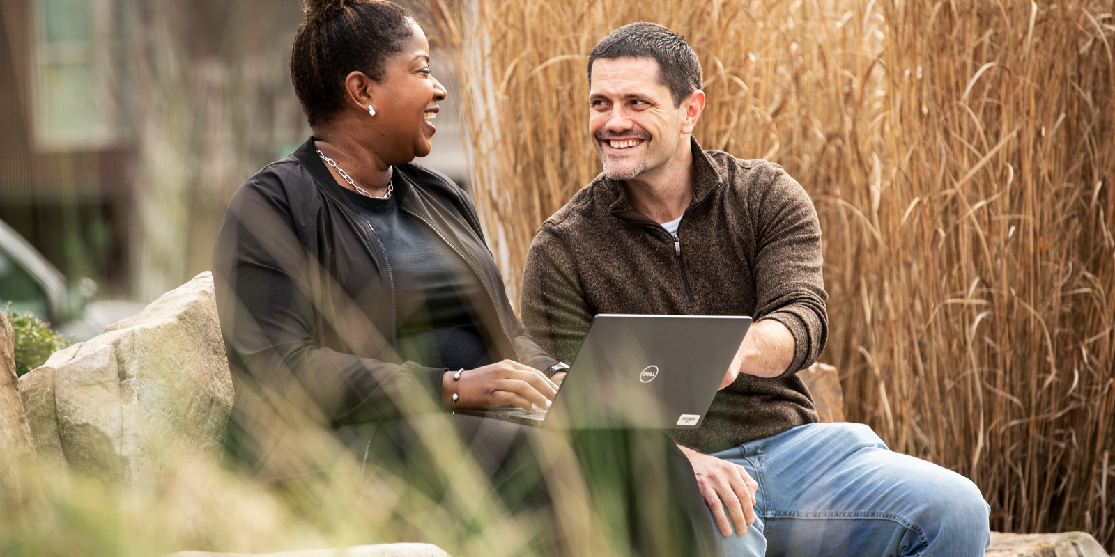 Cox employees collaborating outside