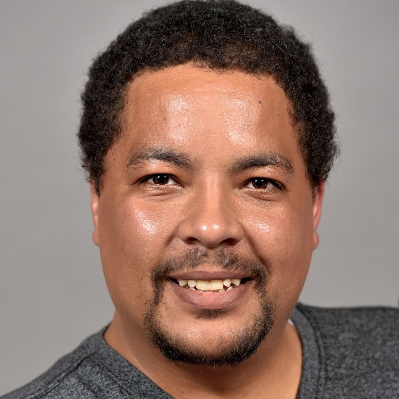 a Cox employee smiling at camera