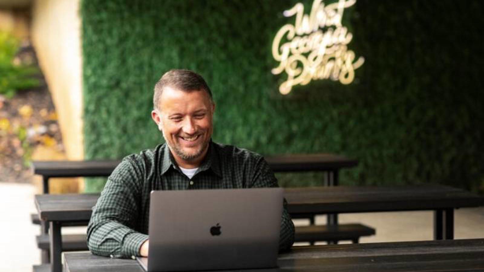 Person typing on laptop