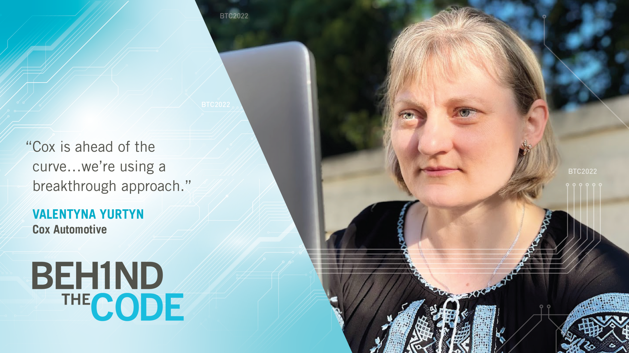 a Cox employee sitting in front of a laptop