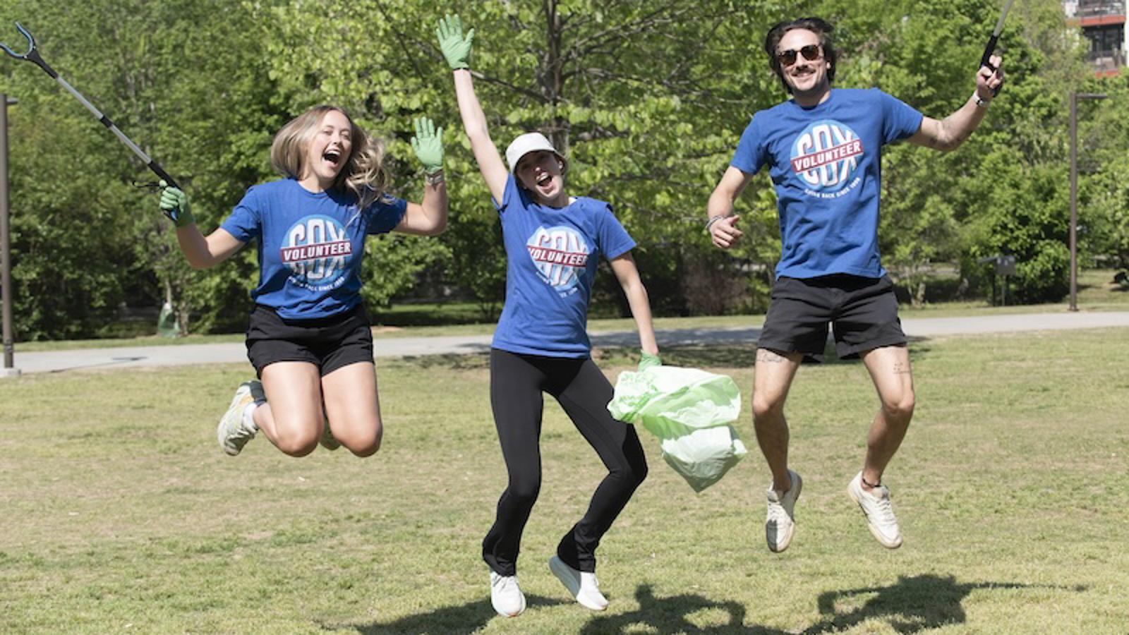 a group of people jumping in the air