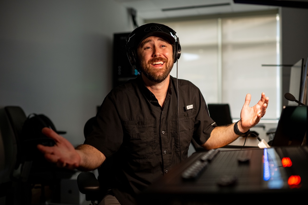 a person wearing headphones and smiling