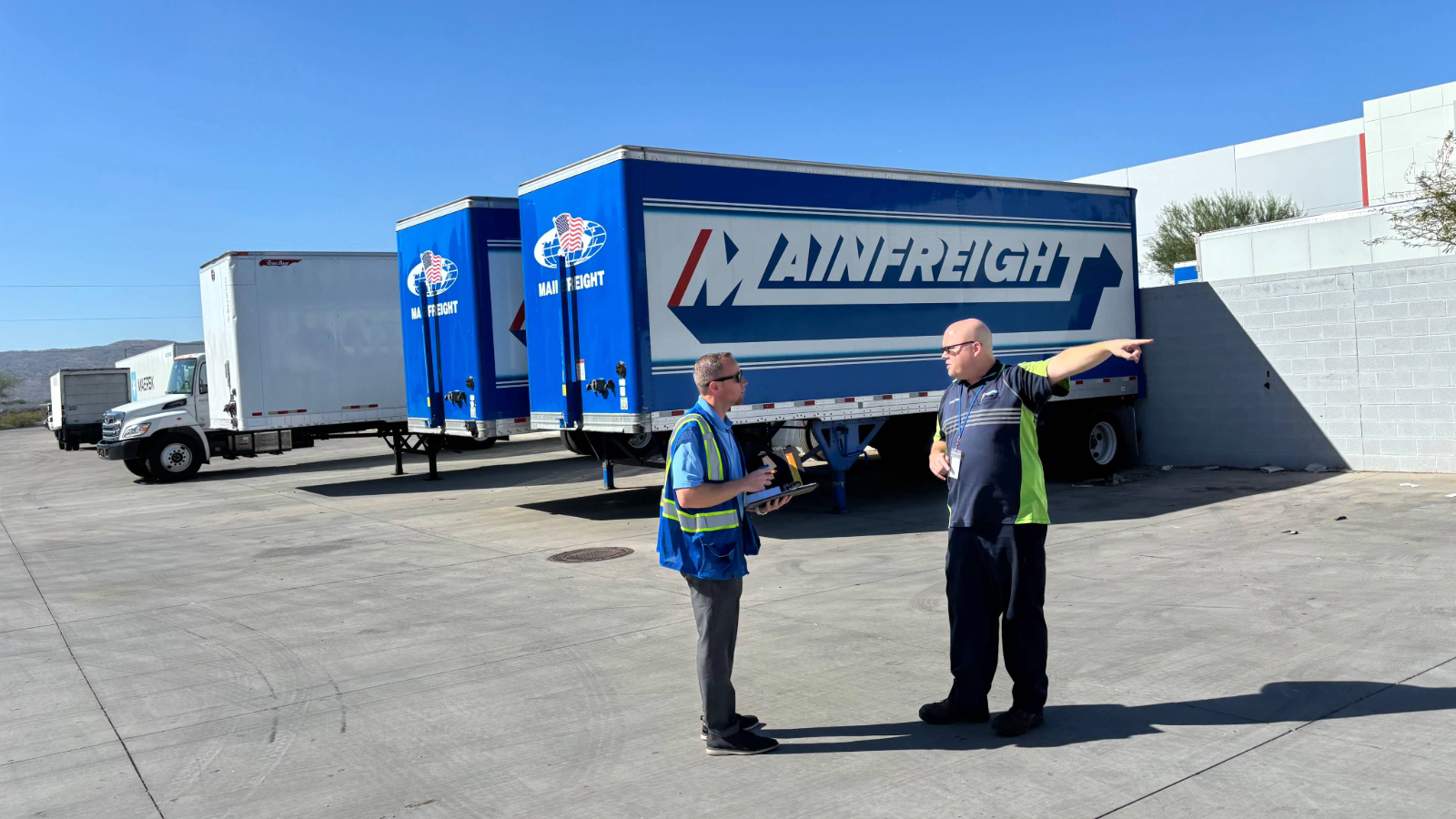 a person pointing at another person