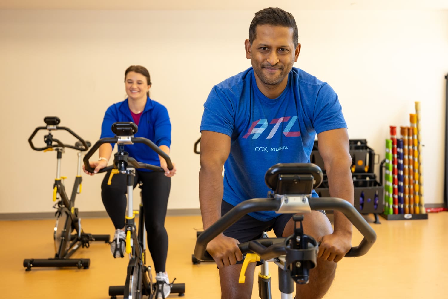 a person and person on exercise bikes