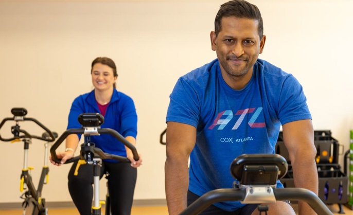 a person and person on exercise bikes