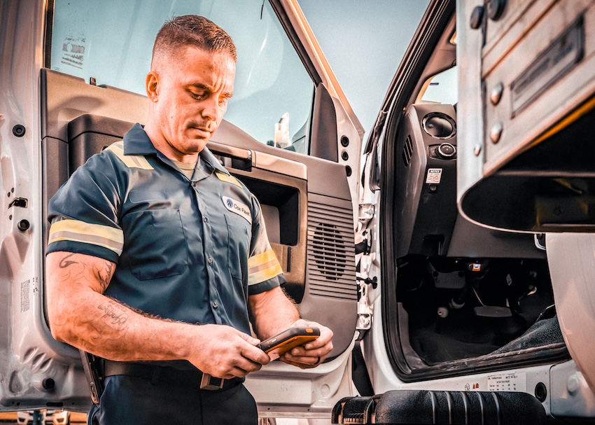 a person in uniform looking at his phone