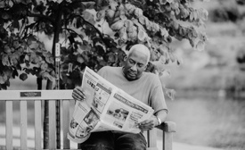 Dayton Daily News employee reading newspaper