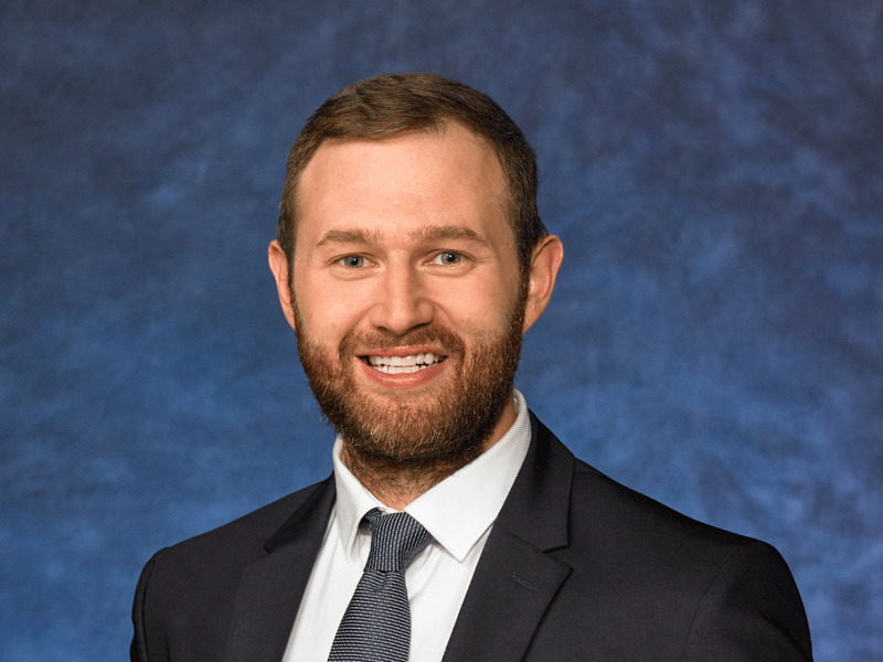 a Cox employee smiling at camera